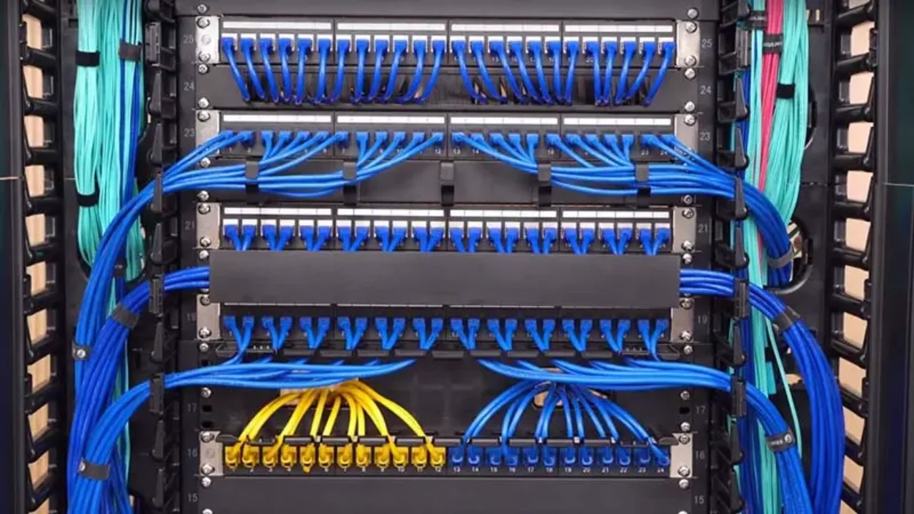 Professionally organized server rack with color-coded and neatly bundled cable runs